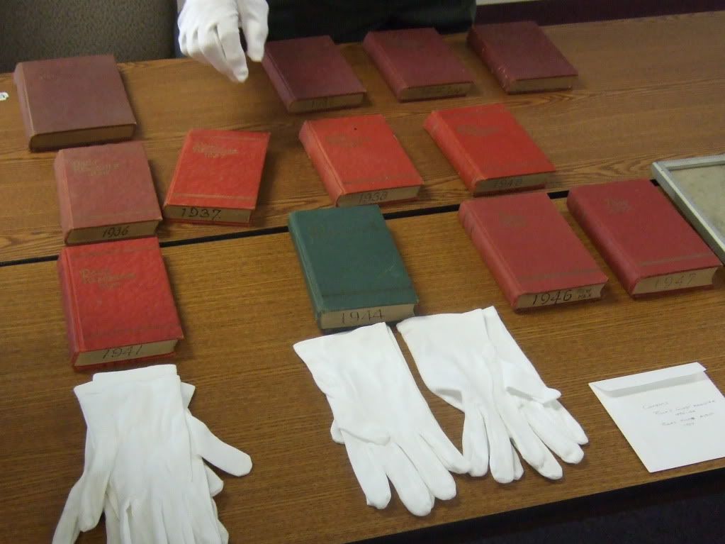 Supt Boles Day Event Reminder Books and park's protective gloves for handling artifacts