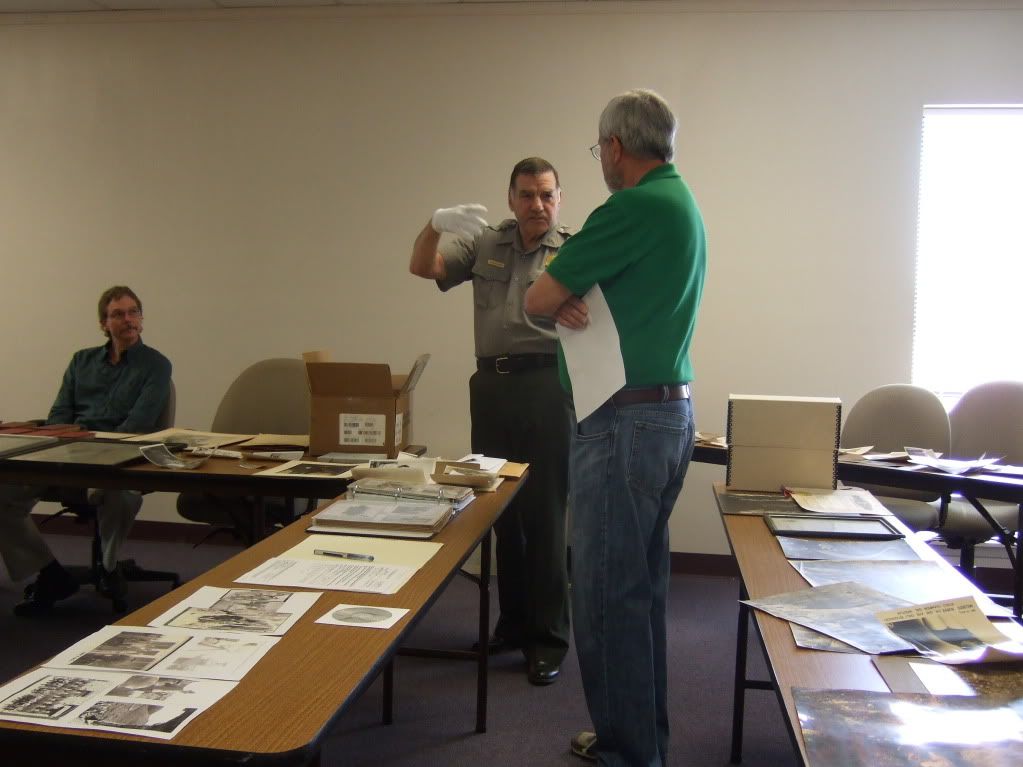 CAVE Supt John Benjamin and Mr. McGuire with part of collection exhibited on table